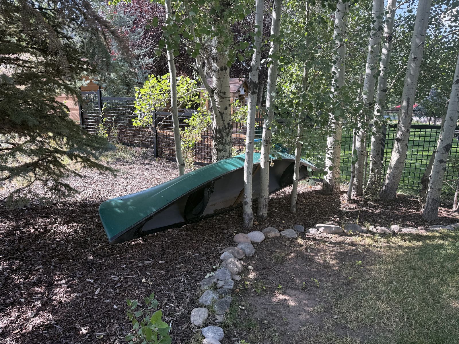 Old Town canoe with flip-up seatbacks and two paddles included