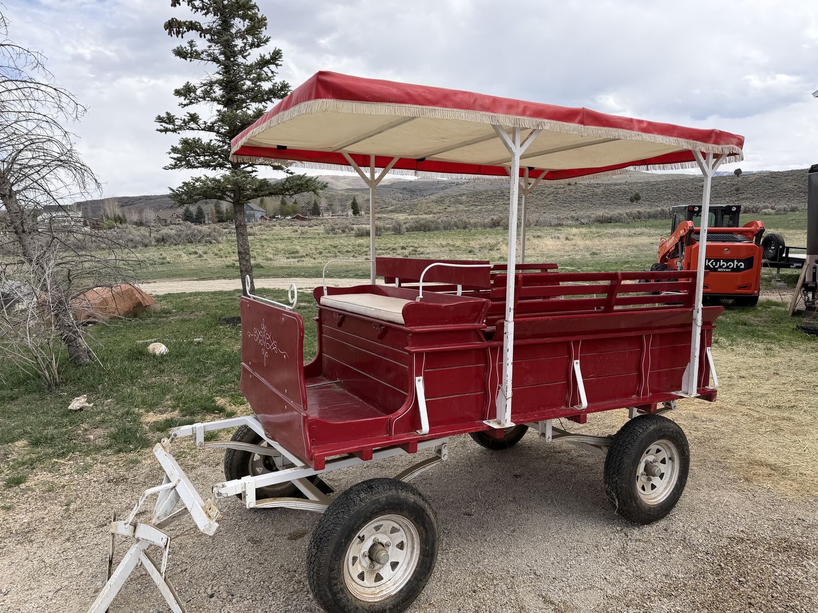 Red Horse-Drawn Wagon with Canopy – Seats Approximately 8 Passengers