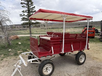 Red Horse-Drawn Wagon with Canopy – Seats Approximately 8 Passengers
