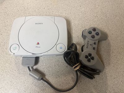 SLIM PS1 CONSOLE FOR PARTS. INCLUDES REMOTE AND CONSOLE ONLY