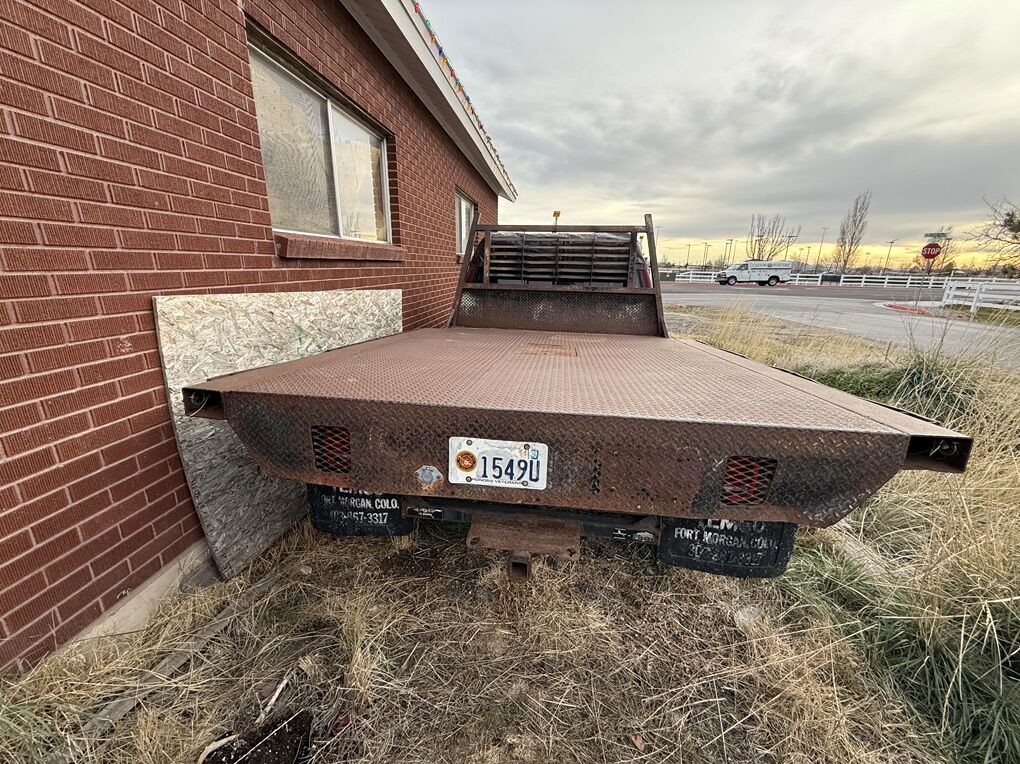 Metal flatbed with gooseneck hitch