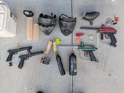 Comprehensive Paintball Gear Lot: Markers, Masks, Tanks, Pods & More - Ready for Action!