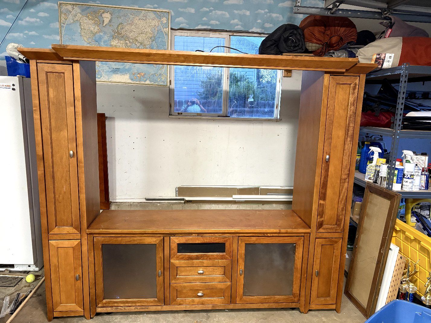 Wooden Entertainment Center with Storage Towers and Glass-Front Cabinets