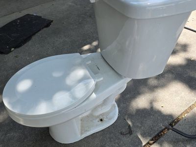 White Two-Piece Elongated Toilet with Tank and Seat