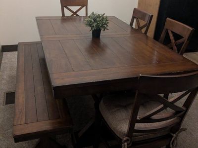 Rectangle dining table with built-in leaf, 6 chairs and bench.