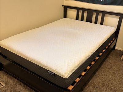Full Mattress and Black Wooden Frame