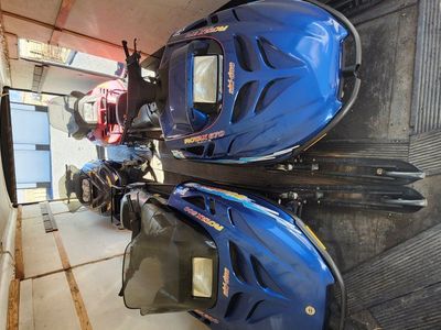 4 Snowmobiles and 4 place enclosed trailer