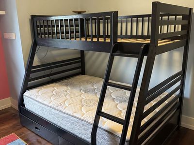 Bunk bed with full mattress, storage drawers