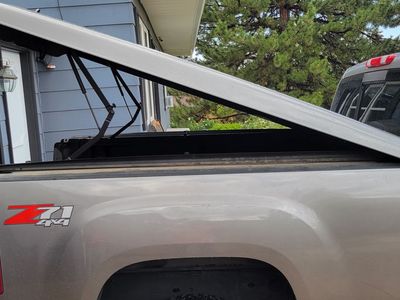 One-piece A.R.E. fiberglass pickup bed cover that fits 6.5 bed