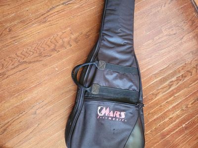 Mars Music Soft Guitar Bag. Very nice canvas. Has a pockets and shoulder strap and carrying straps.
