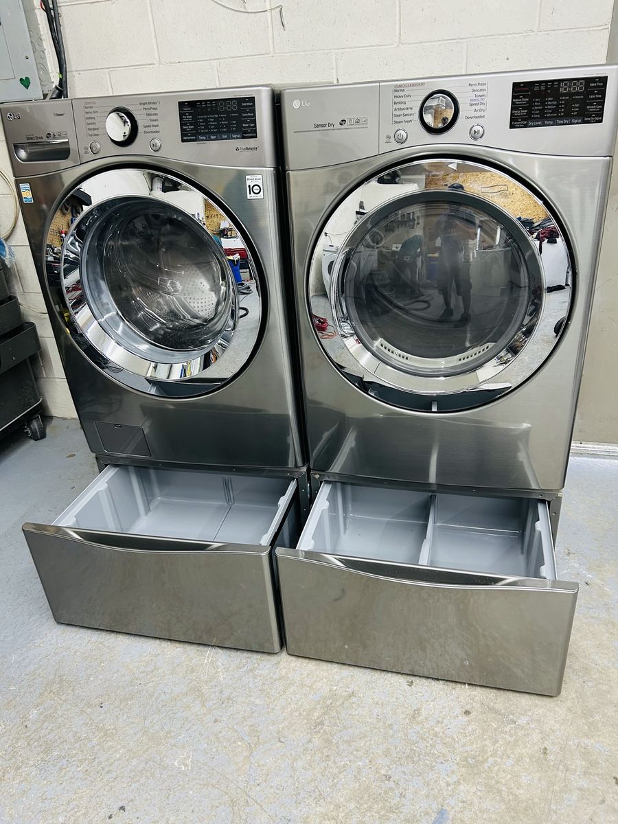 LG stainless washer and dryer set with pedestals