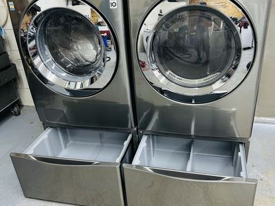 LG stainless washer and dryer set with pedestals
