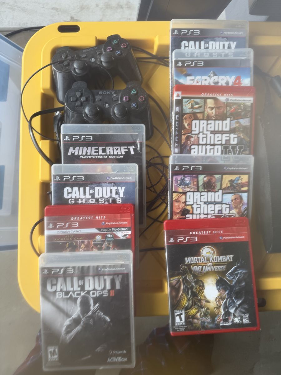 PS3 with 2 controllers and 9 games