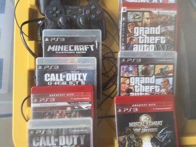 PS3 with 2 controllers and 9 games