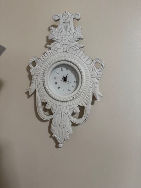 decorative Rococo-style wall clock.