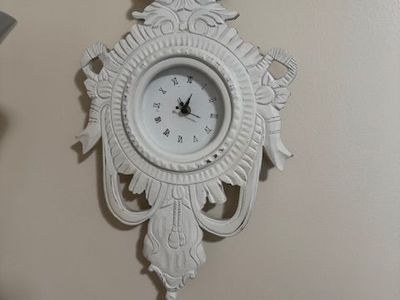decorative Rococo-style wall clock.