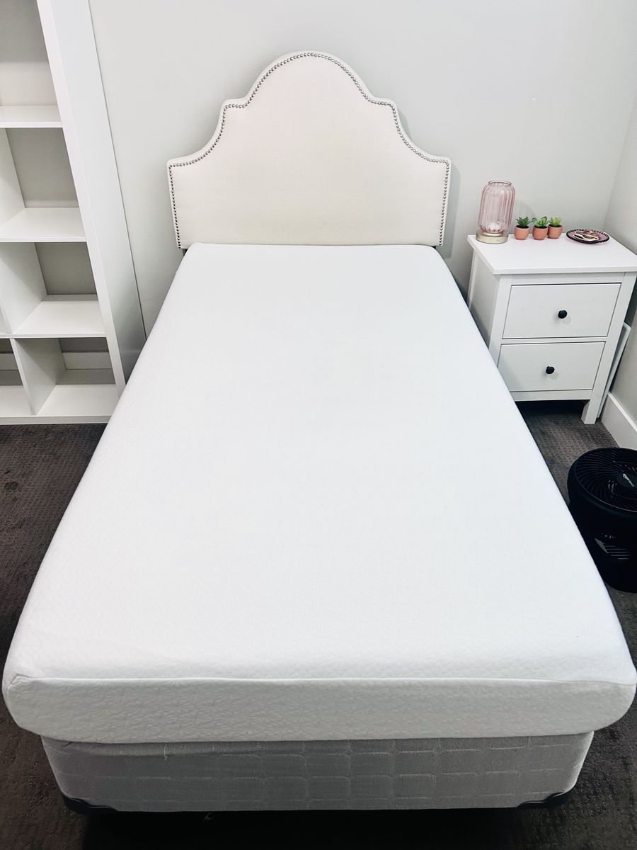 Set of two Cream linen upholstered headboards, mattresses, boxsprings and bed frames