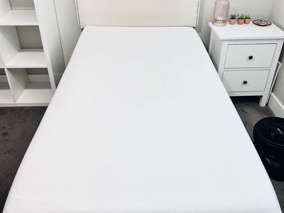 Set of two Cream linen upholstered headboards, mattresses, boxsprings and bed frames