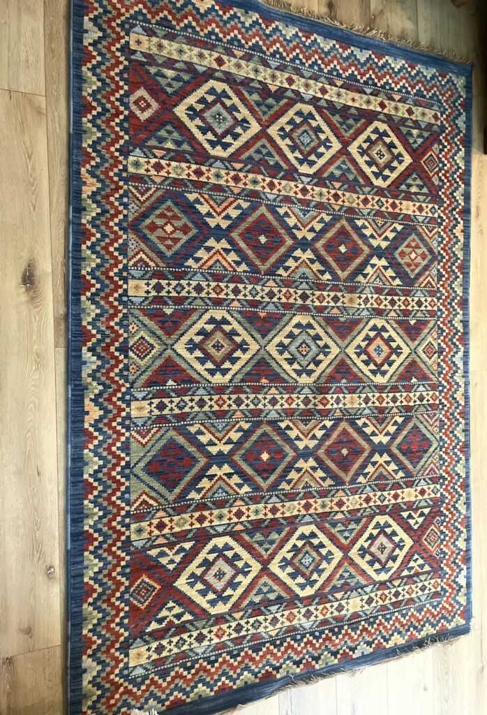 100% Wool Rug 62” X 91”