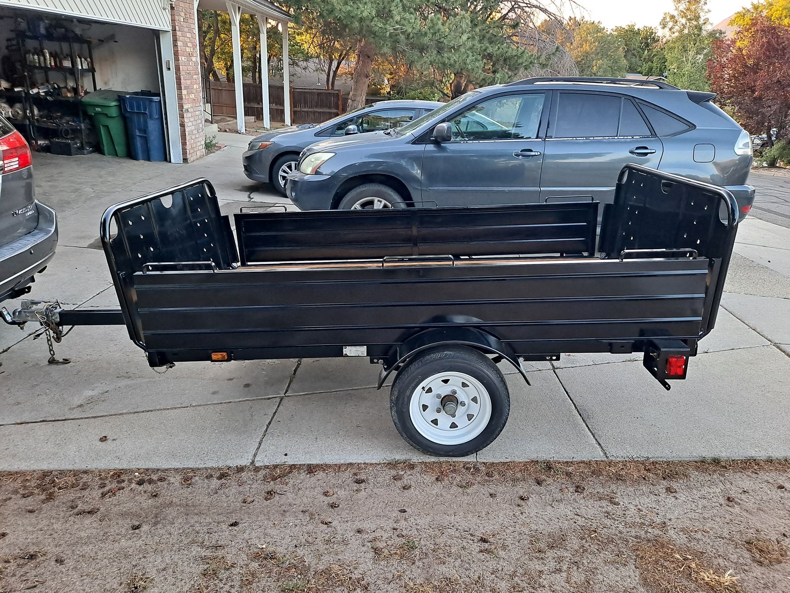 5x8 utility trailer, strong box, tilt function.