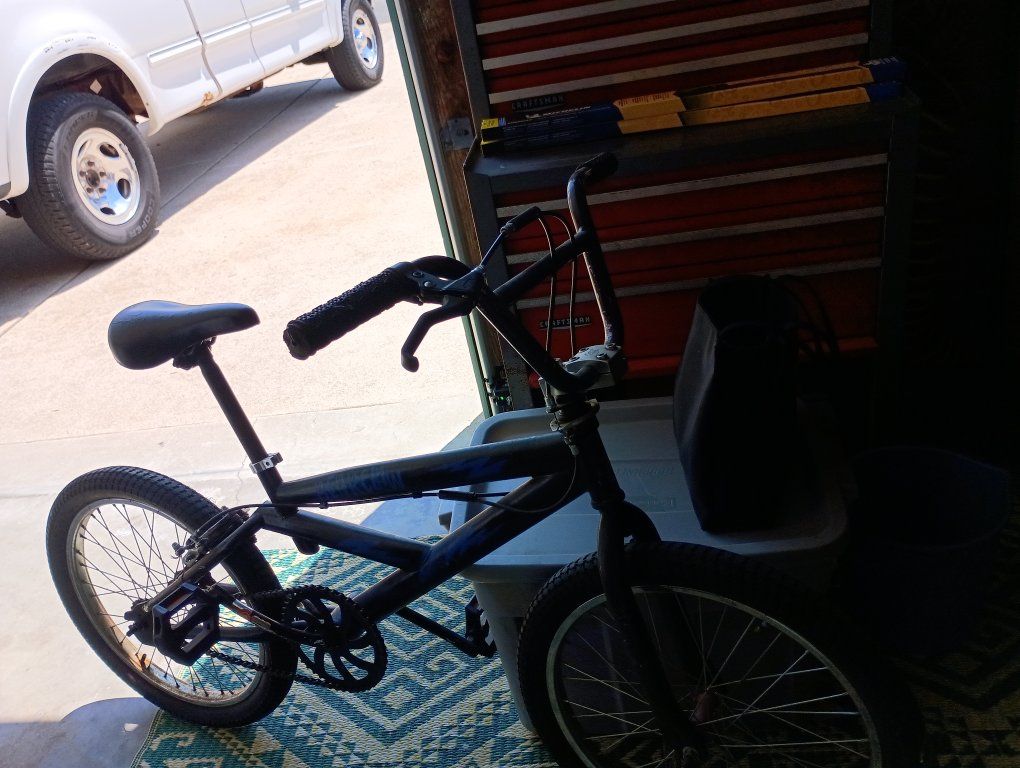 Black Youth BMX Style Bicycle with Hand Brakes. TIRES ARE IN GOOD CONDITION.  SEAT ACCOMMODATES TALL FOLKS