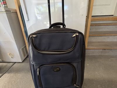 American Tourister Rolling Luggage Suitcase