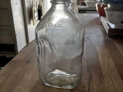 Cream Weber milk crate with jugs