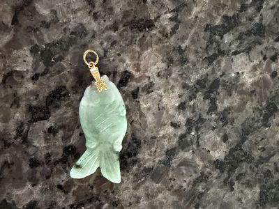 Carved Green Jade Fish Pendant with Gold Bail