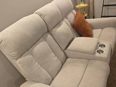 dual recliner couch with console storage