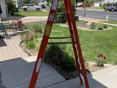 Located in West Jordan - Werner 6-Foot Orange Fiberglass Step Ladder - Heavy Duty