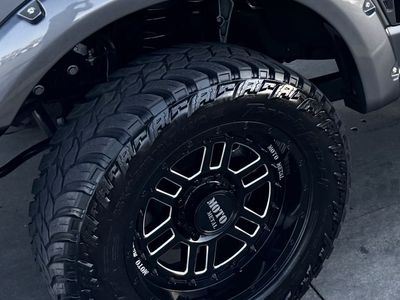 Moto Metal 20” wheels, -18 offset. Amp M/T tires 35x12.50R20LT, 8x170 bolt pattern