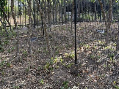 Dog Proofer Black Wire Mesh Outdoor Fence with Metal Posts and fabricated gate