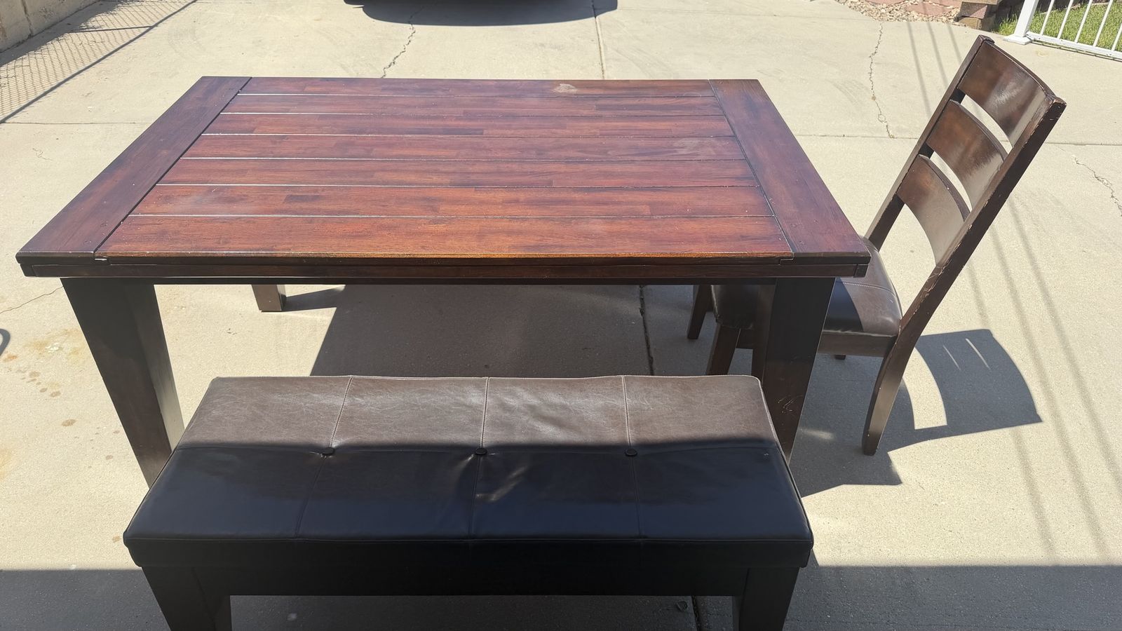 Dining table with one chair and two benches