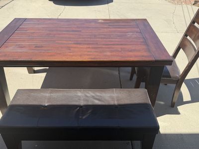 Dining table with one chair and two benches