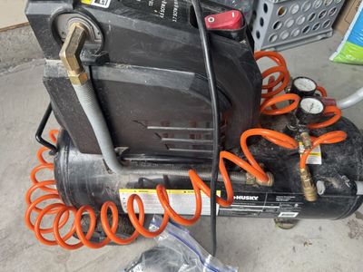Husky 8 Gallon 135 PSI Portable Electric Air Compressor with Hose and Accessories - Used looks dirty but good condition