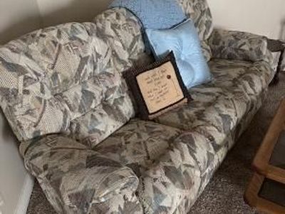 late 1980s–1990s upholstered sofa with a typical floral/geometric pattern.