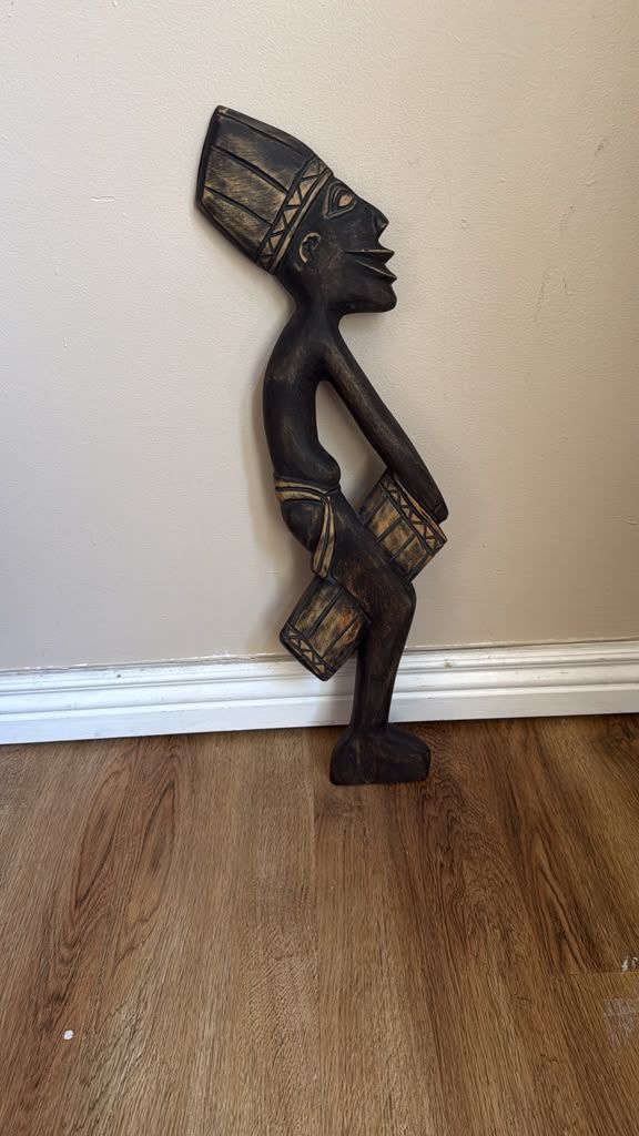 hand-carved African wooden drummer sculpture