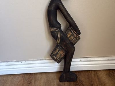 hand-carved African wooden drummer sculpture