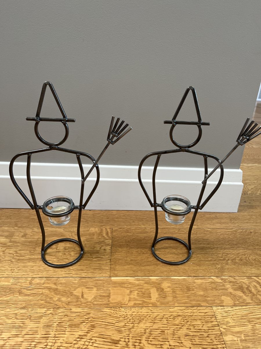 Pair of fun, metal, witch votive candleholders. Like new, 15.5 inches tall