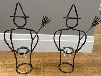 Pair of fun, metal, witch votive candleholders. Like new, 15.5 inches tall