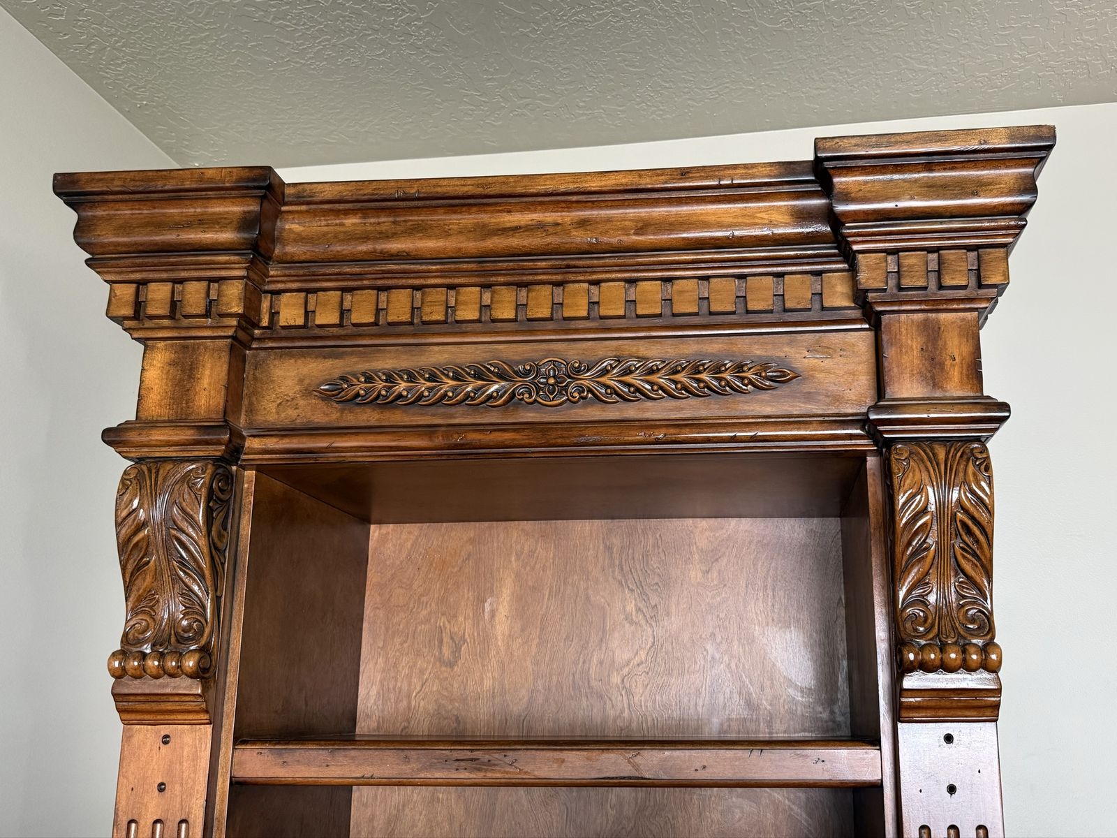 Classic tall wooden bookcase with bookshelf and drawer