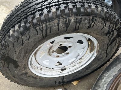 Goodyear Wrangler LT Tire Mounted on White Steel Wheel