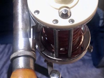 Vintage Wooden Fishing Rod with White Spool Reel - Classic Collectible Fishing Gear