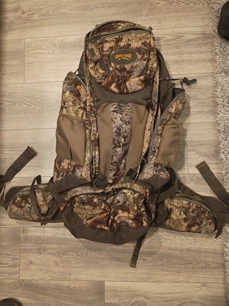 Rustic Ridge Camo Hunting Backpack - Multi-Pocket Gear Backpack thick padded shoulder straps and waist strap.