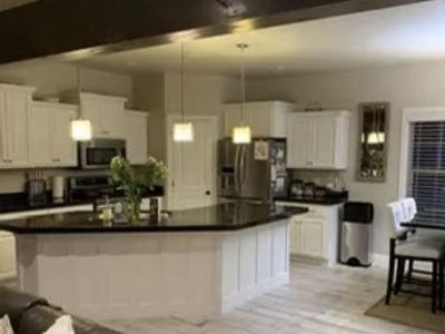 Granite counters and white cabinets