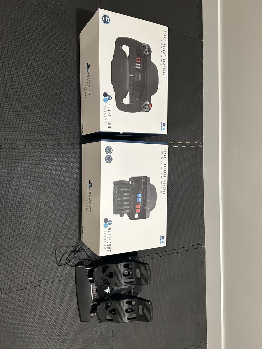 Honeycomb Alpha and Bravo Full Flight Simulator setup with Thrustmaster Rudder Pedals and Trackir.