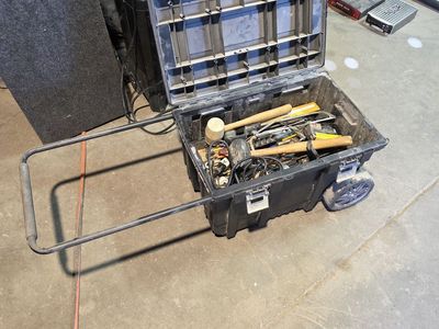 Tool box on wheels full of tools
