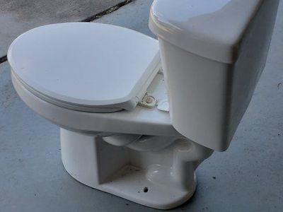 White Porcelain Two-Piece Toilet with Seat and Tank, Used