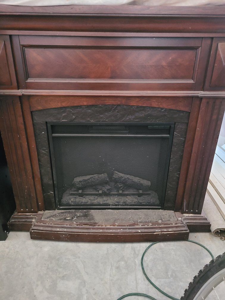 Used Electric Fireplace Stove with Wood Mantel - Dark Cherry Finish, Realistic Log Set