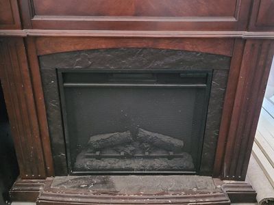 Used Electric Fireplace Stove with Wood Mantel - Dark Cherry Finish, Realistic Log Set